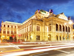 Vienna state opera at night with traffic